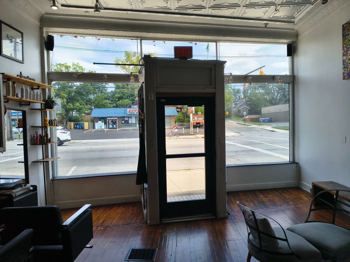Completed commercial window tinting — salon storefront